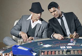 Digital blackjack table showing casino online games with cards dealt and chip stack on screen